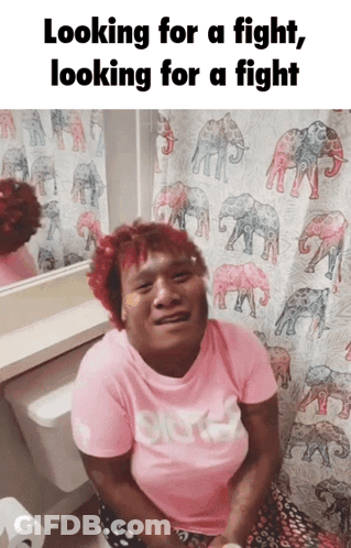 Woman In Pink Shirt On Toilet With Elephant Shower Curtain GIF