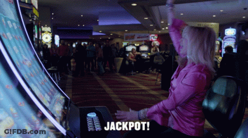 Woman In Pink Shirt Playing Slot Machine GIF