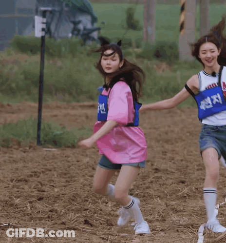 Woman In Pink Shirt Running On Dirt Field GIF