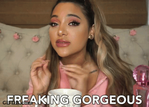 Woman In Pink Shirt Saying Freaking Gorgeous Holding Cup GIF