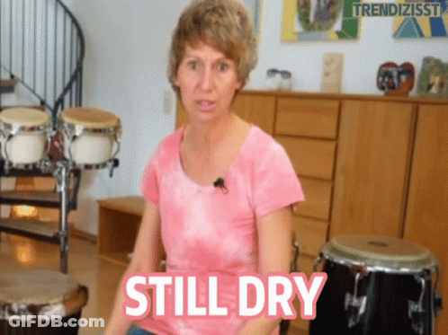 Woman In Pink Shirt Saying Still Dry GIF
