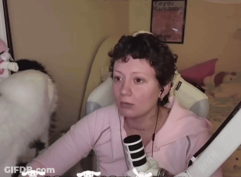 Woman In Pink Shirt Sitting At Microphone With Tayo Kusama Poster GIF