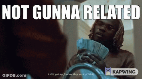 Woman In Pink Shirt Sitting With Hands On Stomach GIF