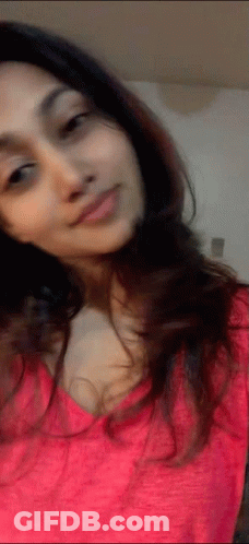 Woman In Pink Shirt Taking Selfie GIF