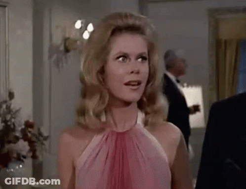 Woman In Pink Shirt Talking On Telephone GIF