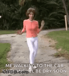 Woman In Pink Shirt Walking On Path GIF
