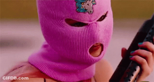 Woman In Pink Ski Mask Holding Gun GIF