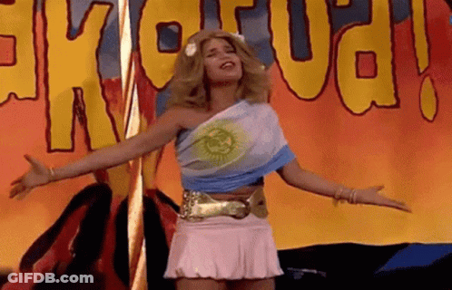 Woman In Pink Skirt At Exotica Sign GIF