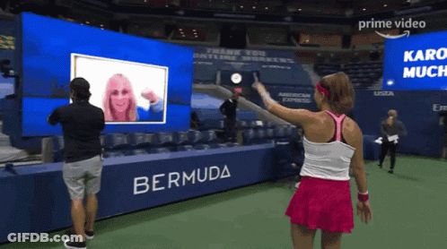 Woman In Pink Skirt In Front Of Bermuda Banner GIF