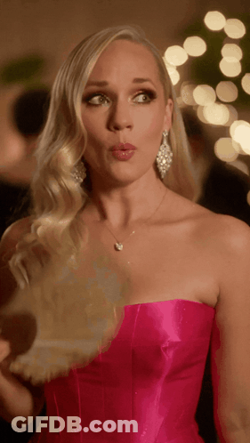 Woman In Pink Strapless Dress With Necklace And Earrings GIF