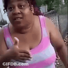 Woman In Pink Striped Tank Top Giving Thumbs Up GIF