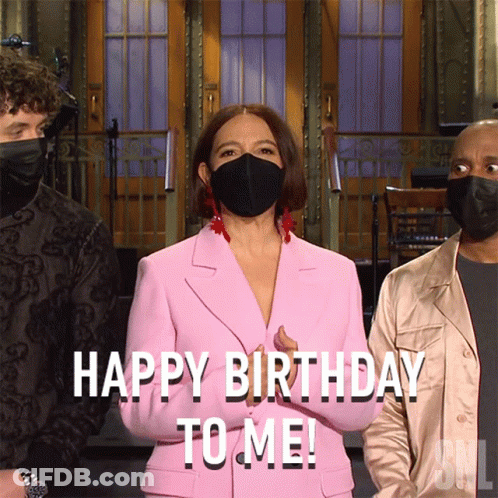 Woman In Pink Suit And Black Mask Saying Happy Birthday To Me GIF