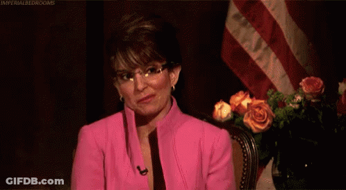Woman In Pink Suit Saying You're Welcome GIF