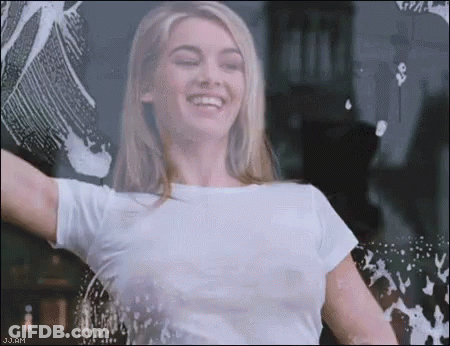 Woman In Pink Suit Smiling GIF