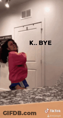 Woman In Pink Sweater And Blue Shorts GIF