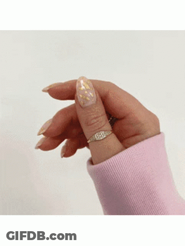 Woman In Pink Sweater And Gold Ring GIF