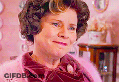 Woman In Pink Sweater And Pink Scarf GIF