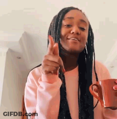 Woman In Pink Sweater Holding Coffee GIF