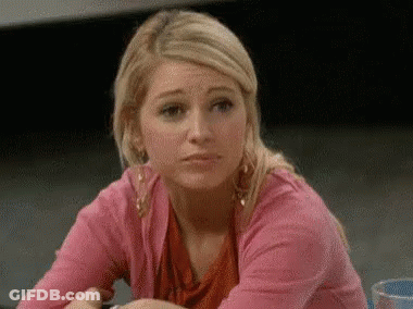 Woman In Pink Sweater Making Funny Face GIF