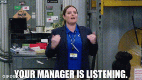 Woman In Pink Sweater Next To Man In Wheelchair At Desk GIF
