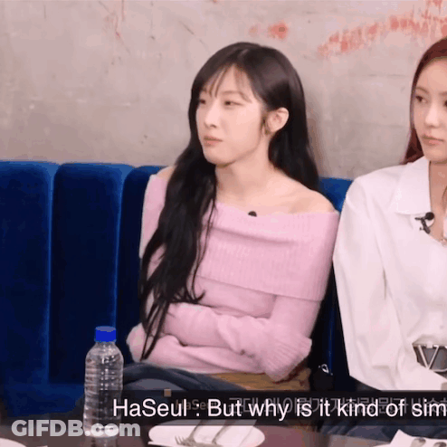 Woman In Pink Sweater Next To Woman In White Saying Haseul GIF
