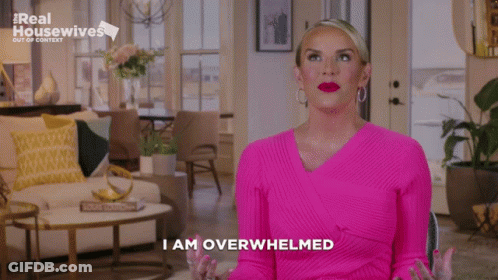 Woman In Pink Sweater Saying I Am Overwhelmed GIF