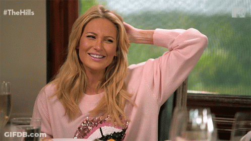 Woman In Pink Sweater Smiling GIF