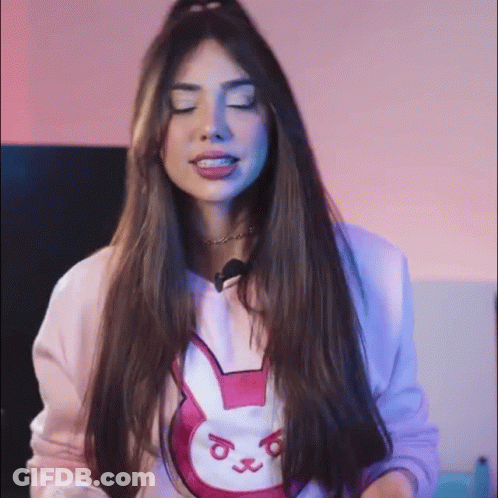 Woman In Pink Sweater With Bunny Eyes Closed GIF