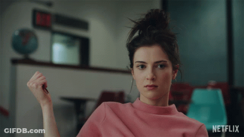Woman In Pink Sweater With Netflix Logo GIF