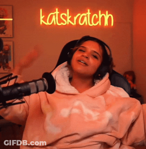 Woman In Pink Sweatshirt And Headphones At Katskratchn GIF