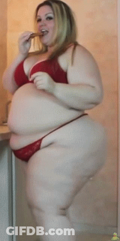 Woman In Pink Tank Top And Black Pants In Front Of Building 411 GIF
