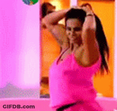 Woman In Pink Tank Top Before Mirror GIF