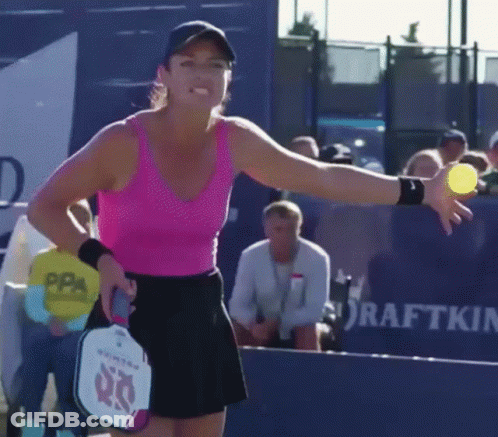 Woman In Pink Tank Top Holding Tennis Ball And Paddle With 60 GIF