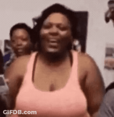 Woman In Pink Tank Top Laughing GIF