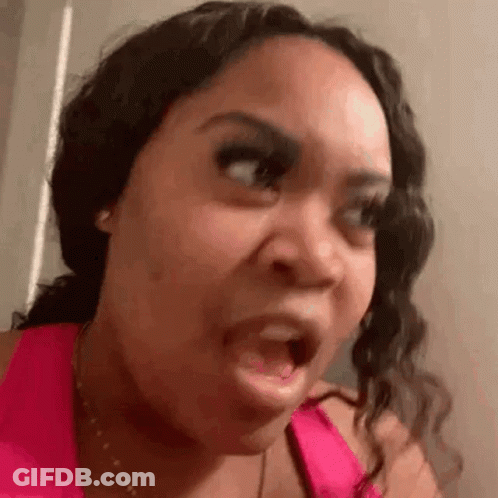 Woman In Pink Tank Top Making Funny Face GIF