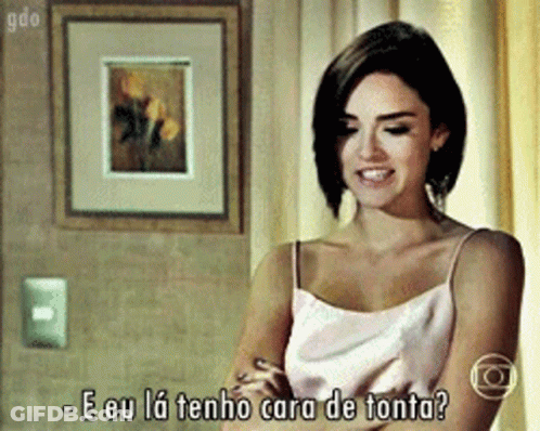 Woman In Pink Tank Top Says E Eu La Tenho Cara De Tonta GIF