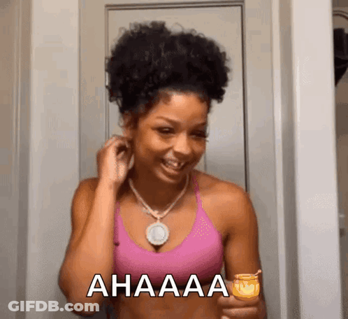 Woman In Pink Tank Top Smiling Holding Candle GIF