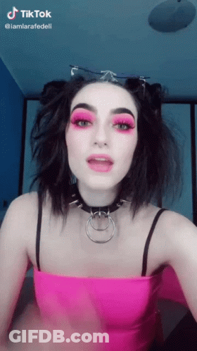 Woman In Pink Top And Choker With TikTok Watermark GIF