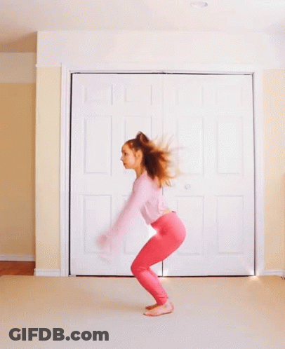 Woman In Pink Top And Pink Pants Jumping GIF