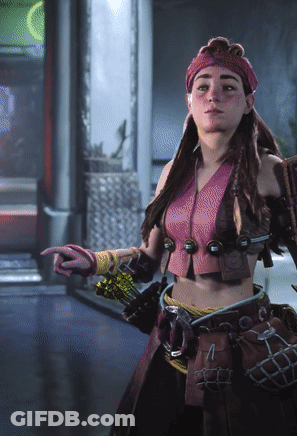 Woman In Pink Top And Red Headband Pointing GIF