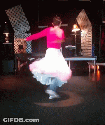 Woman In Pink Top And White Skirt Dancing GIF