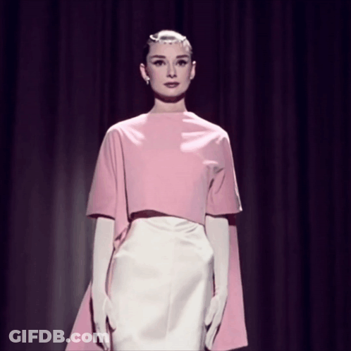 Woman In Pink Top And White Skirt On Stage GIF