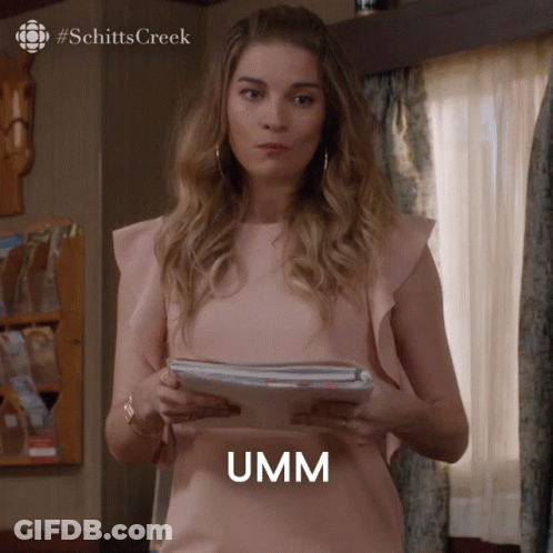 Woman In Pink Top Holding Papers Umm GIF