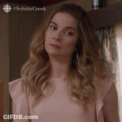 Woman In Pink Top Making Face GIF
