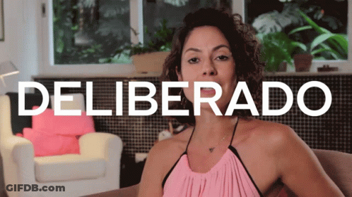 Woman In Pink Top On Couch Deliverado Sign GIF