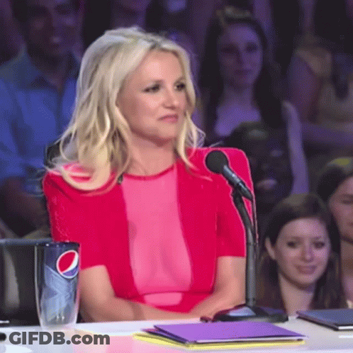 Woman In Pink Top Sitting At Table With Pepsi Cup GIF