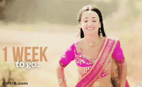 Woman In Pink Top Smiling 1 Week To Go GIF