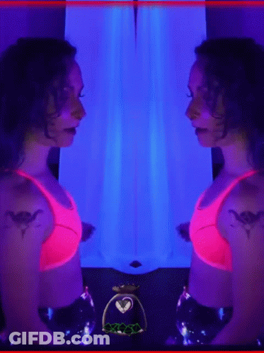 Woman In Pink Top Standing GIF