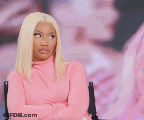 Woman In Pink Turtleneck Arms Crossed GIF