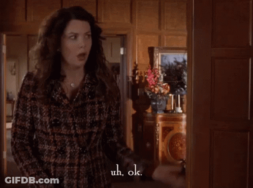 Woman In Plaid Coat Saying Uh Ok GIF